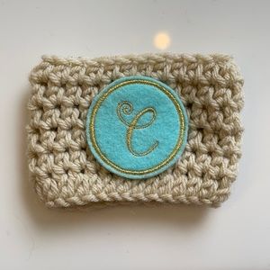 “C” monogram coffee cozy.